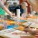 A group of people enjoying art class